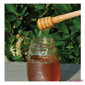 Fából készült mézcsurgató